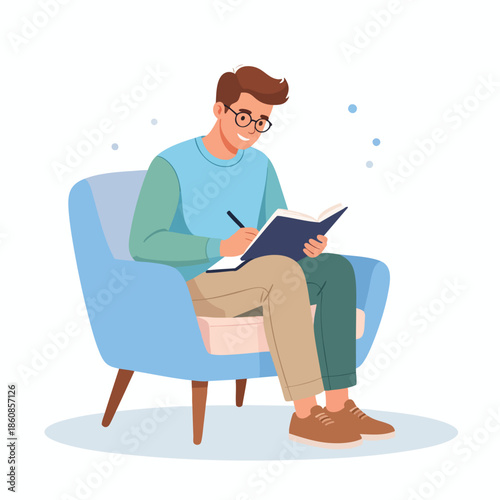 Man sitting comfortably in a blue chair writing in a notebook with a pen