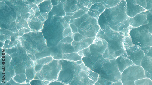 Teal Green Crystal Clear Tropical Ocean Water Surface With Sun Caustics
