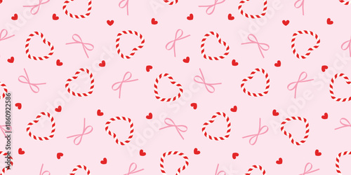 Coquette seamless pattern with red and white candy cane striped hearts, pink bows, tiny red hearts on pink background for valentines 'day stationary, textile, sweet-themed wallpaper.