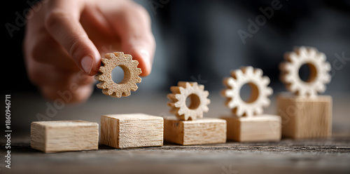 Business process management and automation concept with person moving wooden pieces on flowchart diagram. Workflow implementation to improve productivity and efficiency. Management and organization.