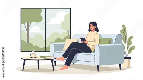 Woman Relaxing on Sofa with Tablet.