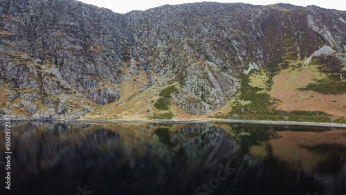 Canvas Print Aerial view of Llyn Eigiau with dark water beneath steep rocky slopes