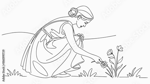 Graceful woman gently picking wildflowers in a sunlit meadow.