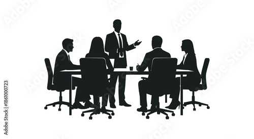 a group of professionals engaged in a business meeting around a table silhouette
