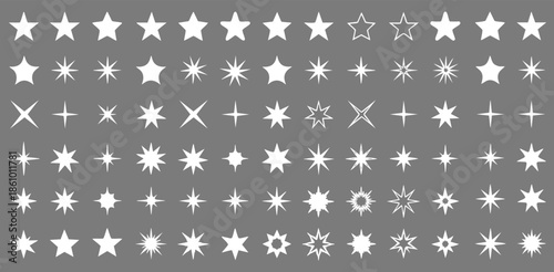 Modern star and sparkle shapes set isolated on black. withe symbols for rating and decoration on black background.