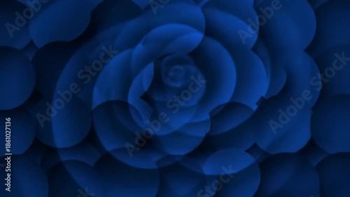 An abstract image featuring swirling shapes of different sizes, a deep blue hue. The composition creates depth and movement