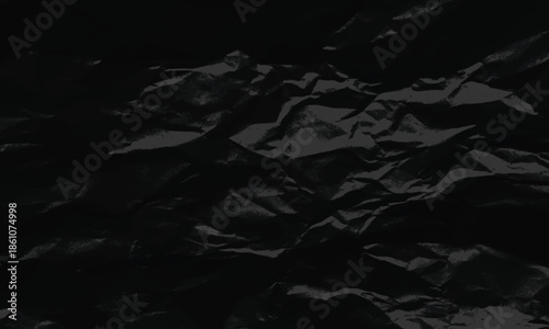 Dark monochrome background featuring detailed texture of crumpled black paper for dramatic visual effect