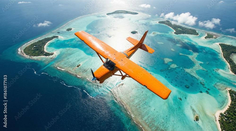 Fototapeta premium Top-down aerial of an orange bush plane flying over tropical lagoons