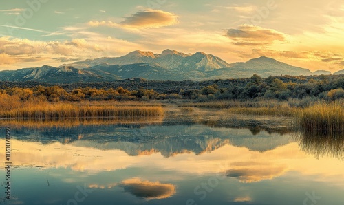 Scenic sunset view of a mountain range with golden light reflecting on a calm lake, soft pastel tones, peaceful and serene atmosphere, panoramic view, sharp detail,