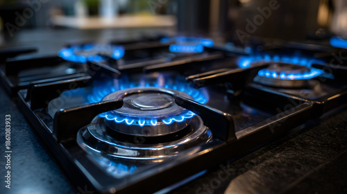 Kitchen stove top with flames lit and ready for cooking dinner in the evening