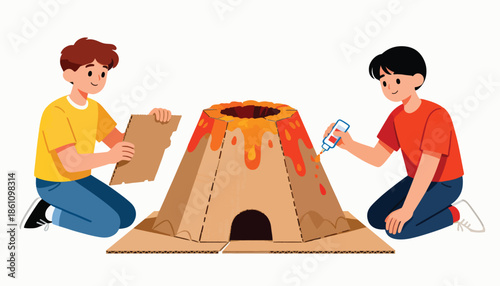 Two boys craft a cardboard volcano model with lava details and a cave