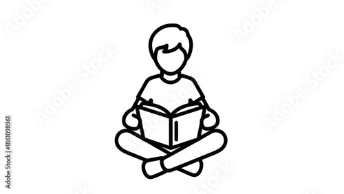 Child sitting cross-legged and reading a book.