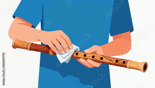 Hands cleaning a wooden recorder with a white cloth