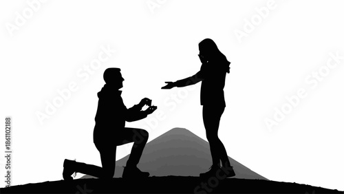 Silhouette of a man proposing marriage to a woman.