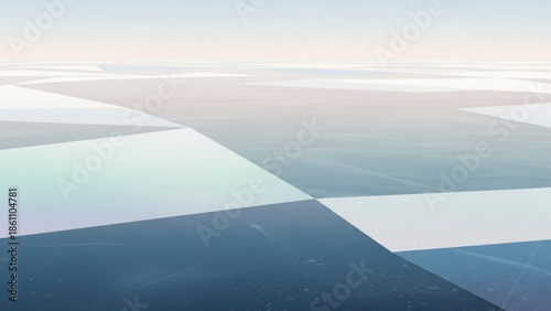 Geometric pattern of blue and white shapes on a reflective surface with a gradient sky