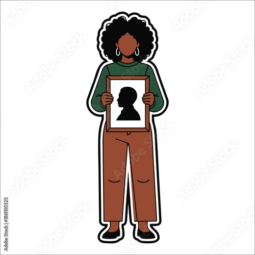Title: Woman holding a framed silhouette portrait of a person with curly hair wearing a green