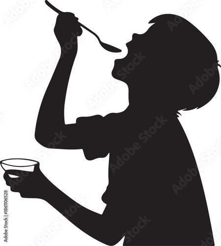 Black Silhouette of a Young Boy Eating Food or Syrup with a Spoon