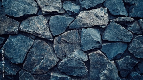 Blue stone background. Toned rock texture. Close-up. Dark blue grunge background