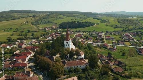 Aerial View Of Fortified Church With Rural Landscape In Cincu, Brasov, Romania. - pullback shot