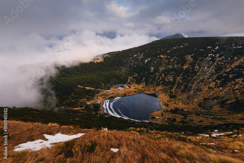 Autumn landscapes of the Karkonosze Mountains near Śnieżka, captured before winter. Dramatic sunrise and sunset light over ridges, valleys, and alpine scenery.