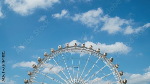 Ferris wheel against blue sky