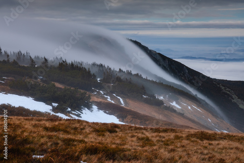 Autumn landscapes of the Karkonosze Mountains near Śnieżka, captured before winter. Dramatic sunrise and sunset light over ridges, valleys, and alpine scenery.