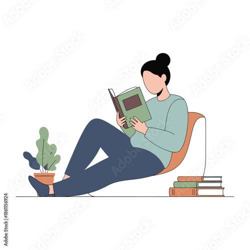 Woman reading a book while relaxing on a chair with a plant and stack of books.