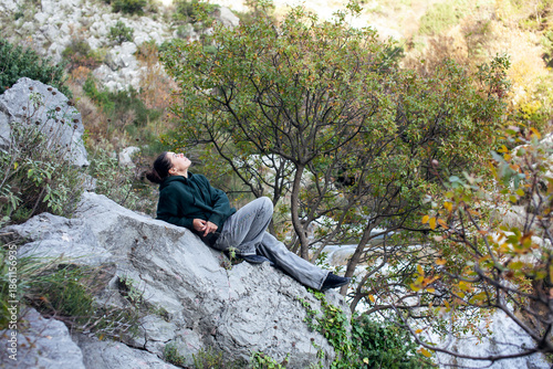 young pretty brunette girl hiking to waterfall, lifestyle people concept