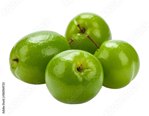 Four green, round fruits with small stems against a dark background