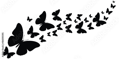 A flock of black butterflies flying in a diagonal line on a white background