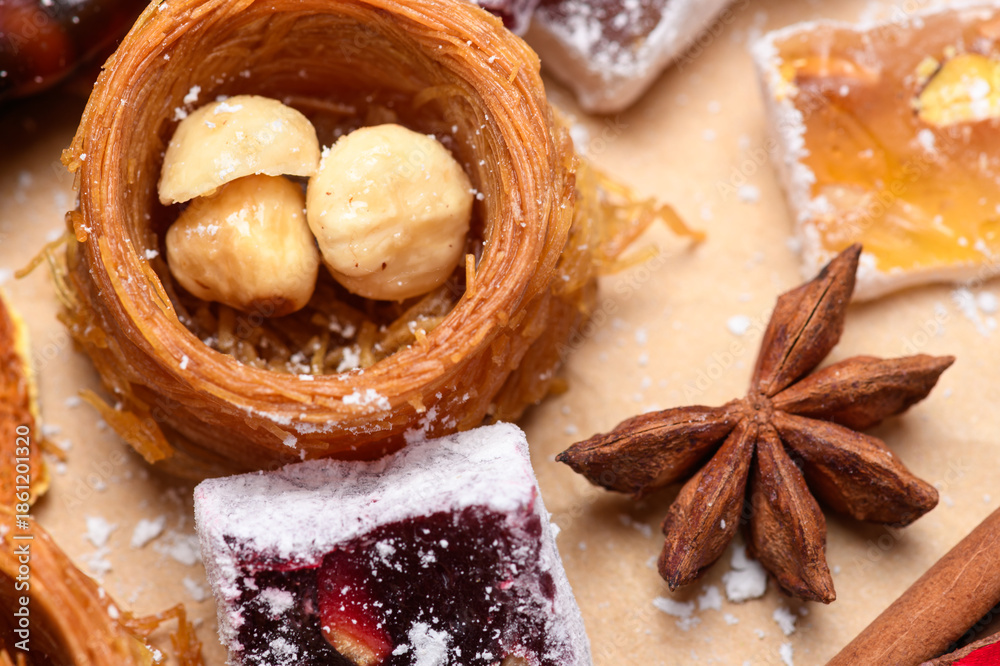 Fototapeta premium Close up of oriental nest sweet with nuts star anise and Turkish delight