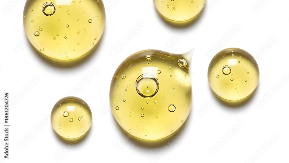 Fototapeta premium Close-up of Yellow Liquid Droplets with Bubbles on White Background, Transparent