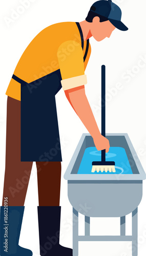 Person in work clothes scrubs a basin of blue liquid with a brush