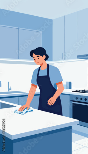 Person in apron wiping kitchen counter with cloth