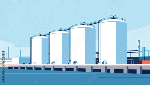 Industrial facility with large storage tanks and pipelines under a blue sky