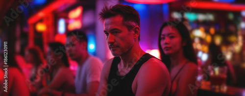 mature man in black tank to...
