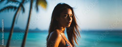 young woman in a bikini sta...