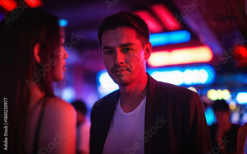 man in a dark blazer and wh...