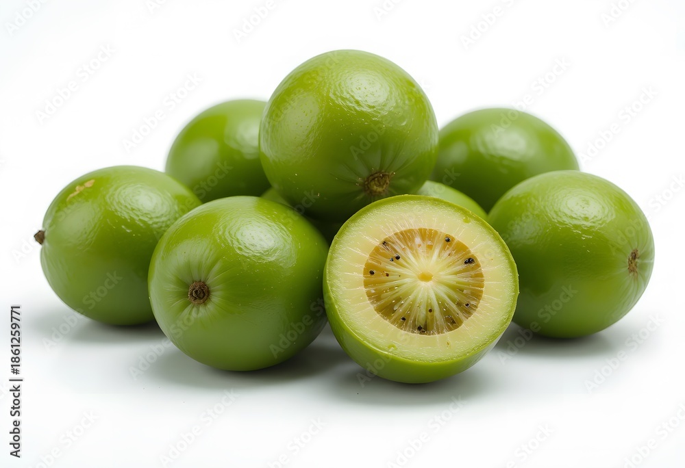 Obraz premium Fresh and vibrant kiwi berries arranged on a pristine white background, showcasing their unique texture. amla fruit