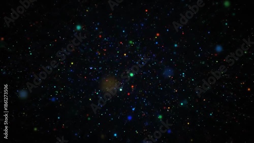 Abstract background of colorful particles against black
