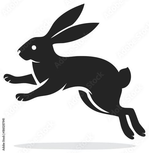 Silhouette of a Black Rabbit Running and Leaping with Ears Upward