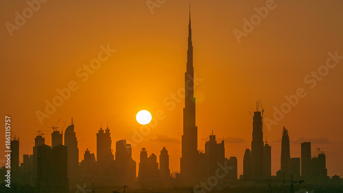 Sunset with skyline of Downtown Dubai in the evening timelapse.