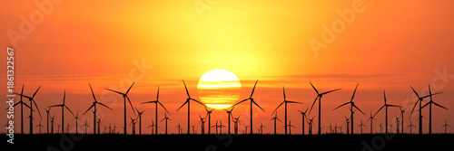 Wallpaper Mural Silhouette of wind turbines against the stunning sunset and orange sky  Torontodigital.ca