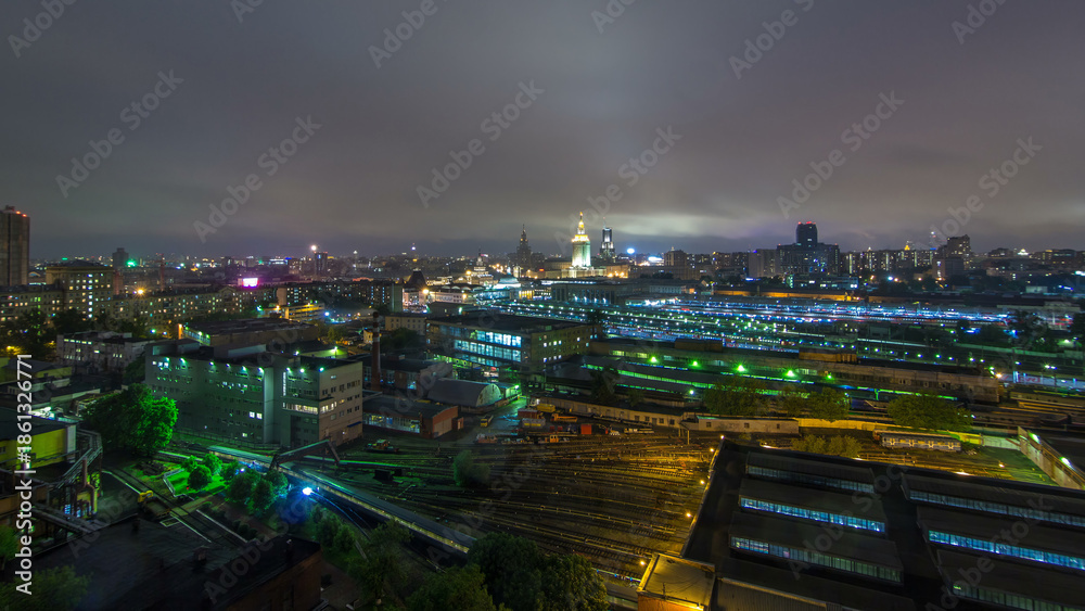 Fototapeta premium Evening top view of three railway stations day to night timelapse at the Komsomolskaya square in Moscow, Russia