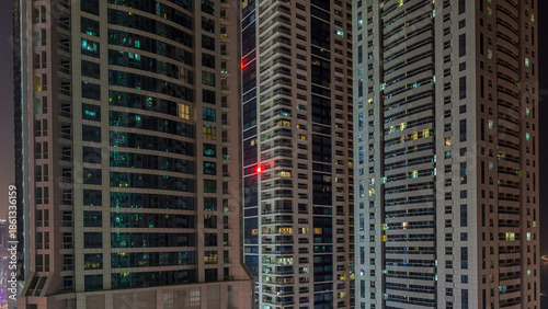 Scenic glowing windows of skyscrapers at night timelapse
