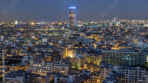 Aerial panorama above houses rooftops in a Paris day to night timelapse