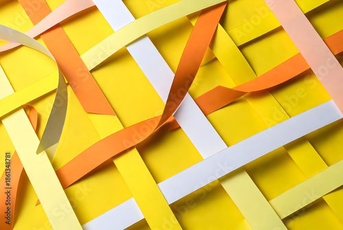 Vibrant yellow background with colorful paper strips