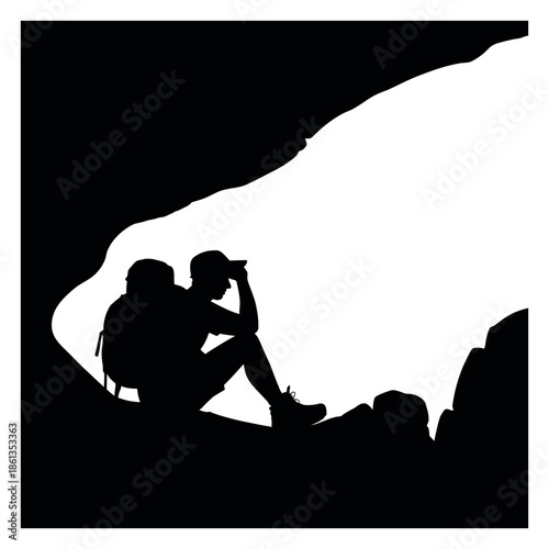 Silhouette of Hiker Resting in Cave Entrance Contemplating and Enjoying Scenery With Backpack and Cap Surrounded by Cave Rocks Outdoors Travel Lifestyle