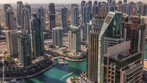 Dubai Marina skyscrapers and jumeirah lake towers sunrise view from the top aerial timelapse in the United Arab Emirates.