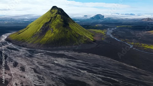Majestic Mossy Volcano Pea Surrounded by Black Sand nd Glacial Rivers